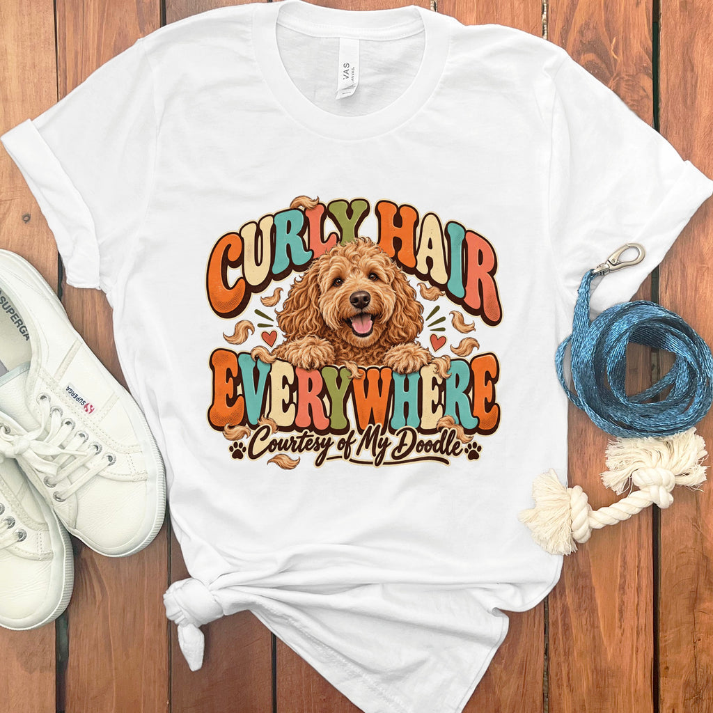 White t-shirt with a doodle dog and text "Curly Hair Everywhere Courtesy of My Doodle".