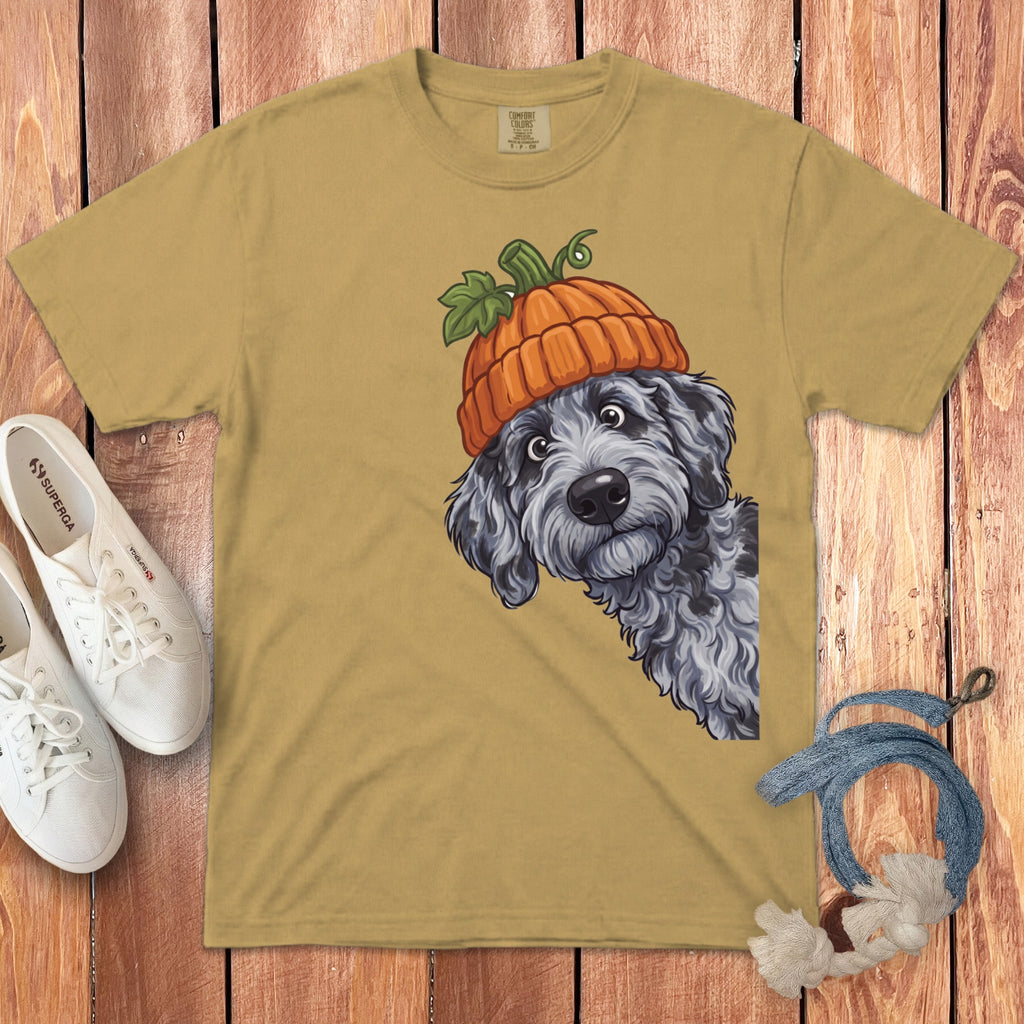 Tan t-shirt with playful dog wearing a pumpkin hat illustration.