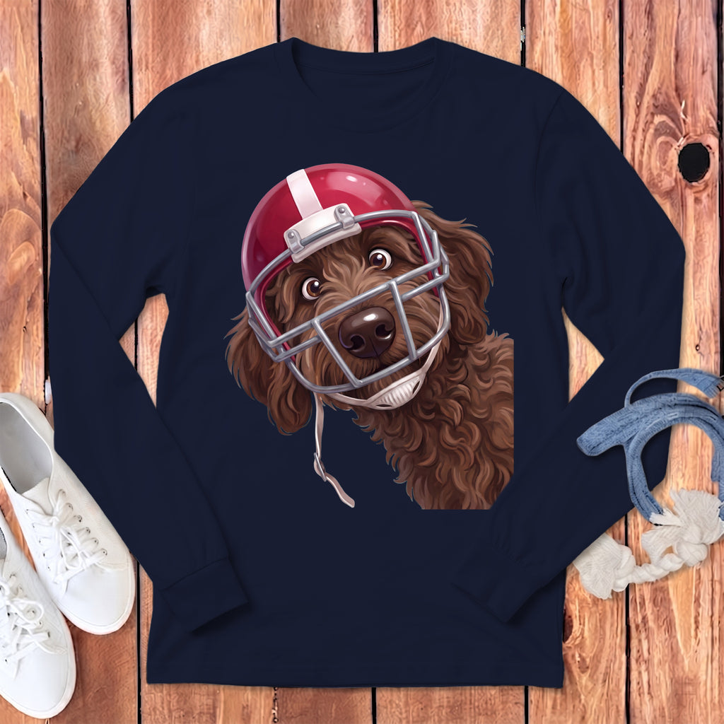 Brown dog wearing a red football helmet and facemask on a navy shirt.