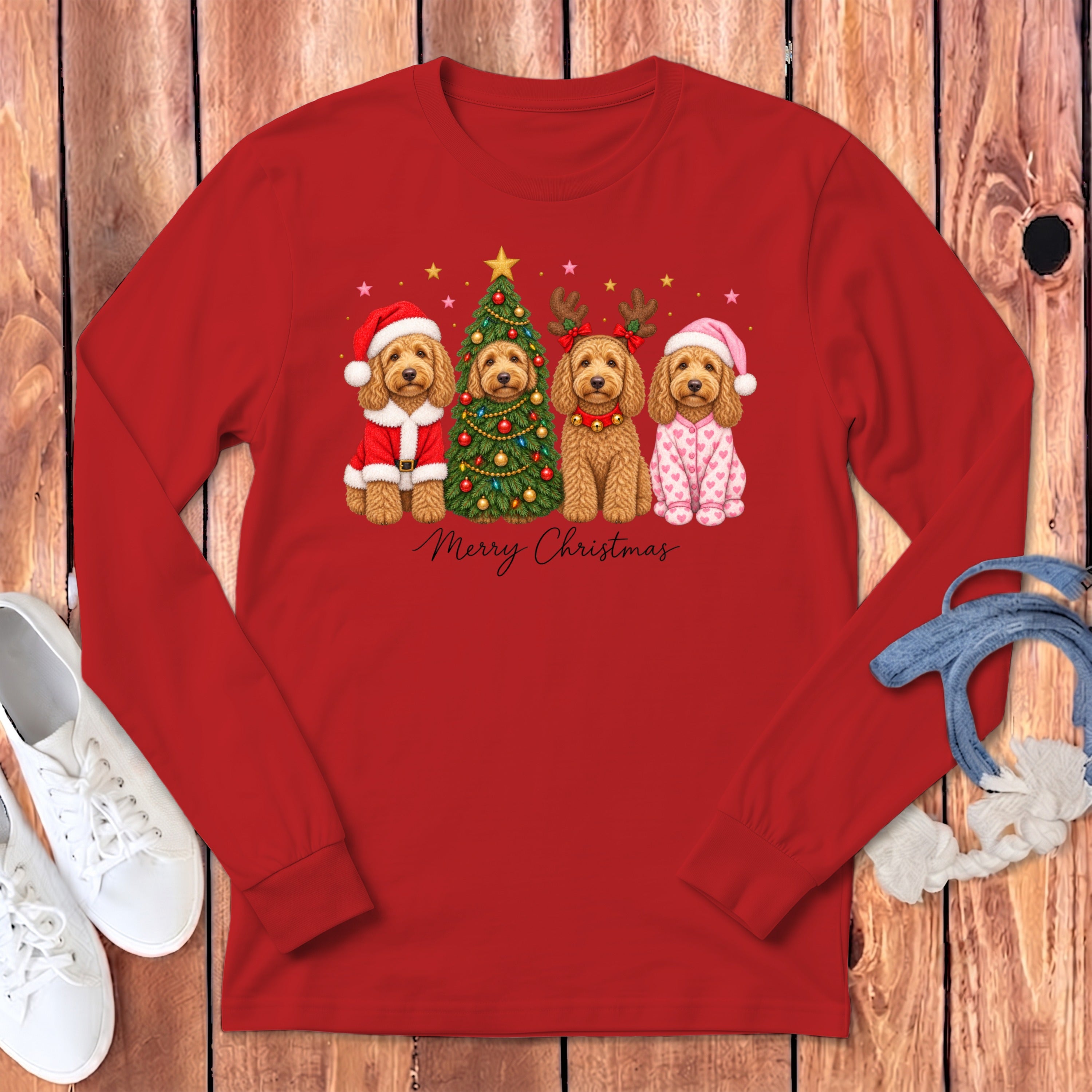 A red long-sleeve shirt displays a Christmas graphic of four golden doodle dogs and Merry Christmas text.