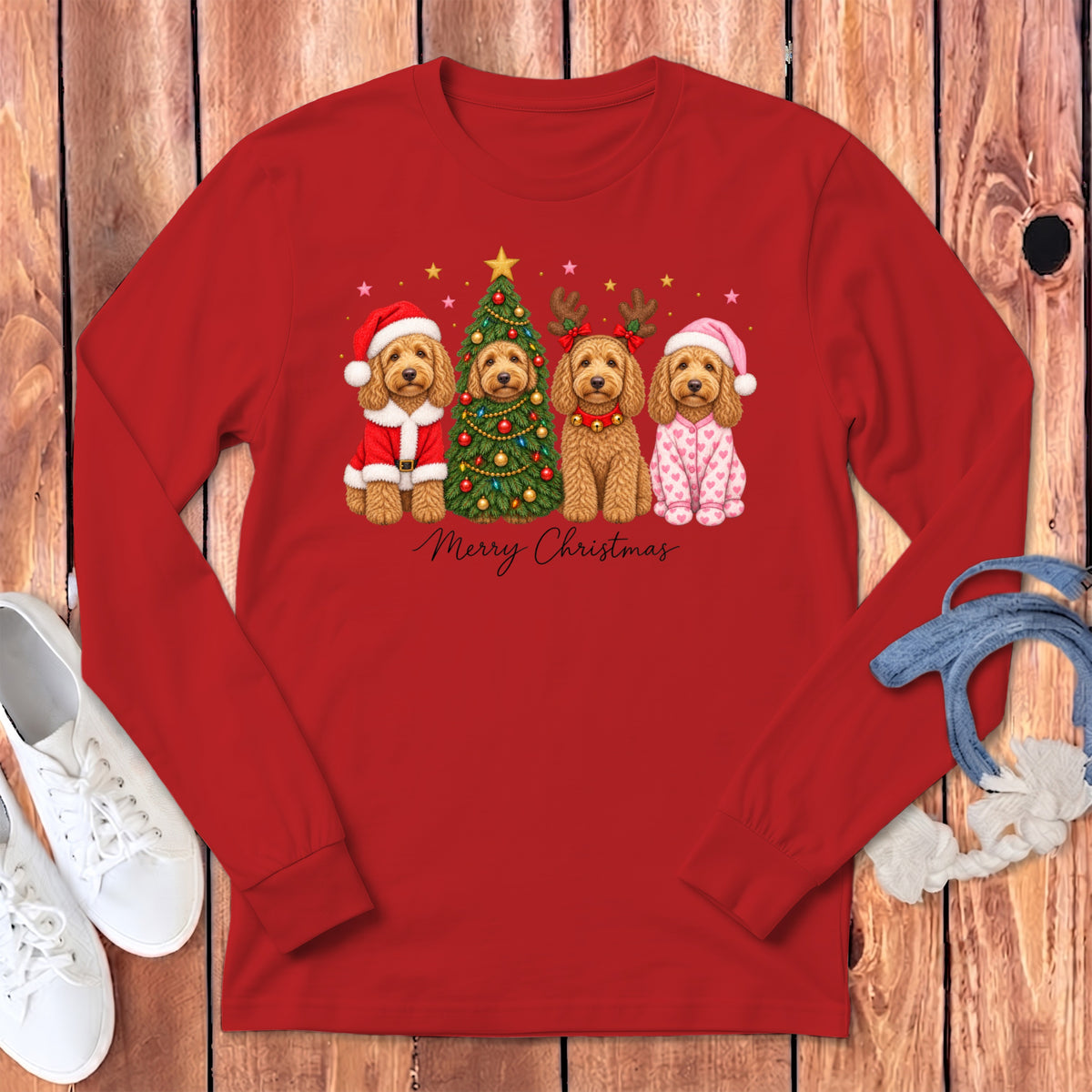 A red long-sleeve shirt displays a Christmas graphic of four golden doodle dogs and Merry Christmas text.