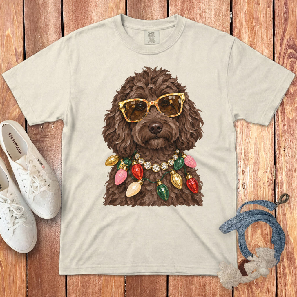 T-shirt with graphic of a brown dog wearing sunglasses and a Christmas light necklace.