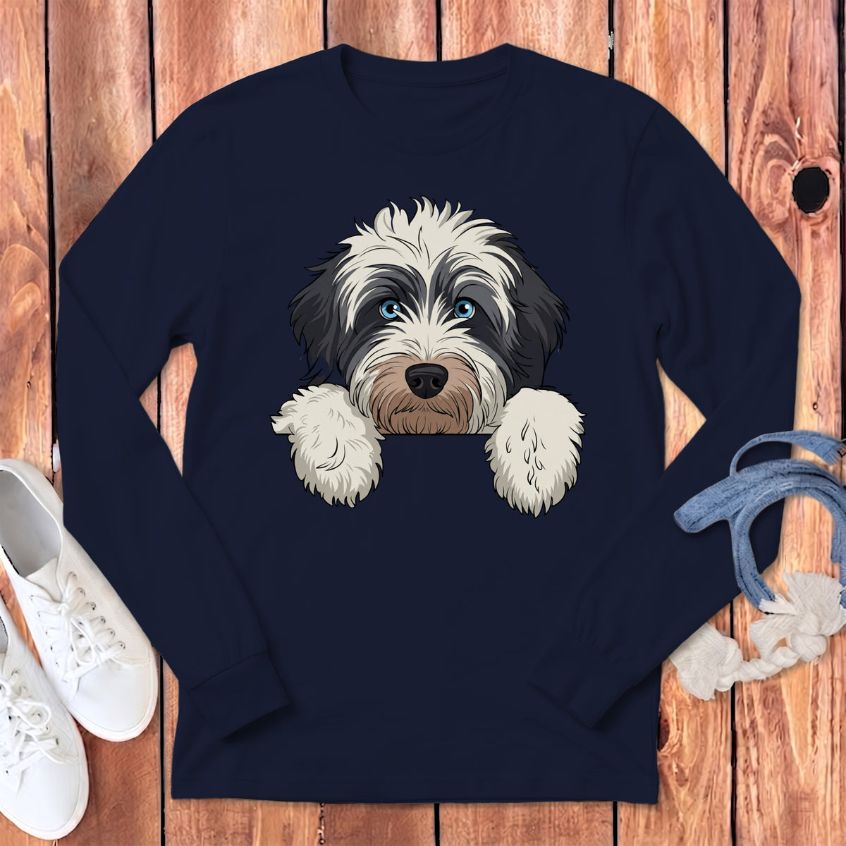 Long sleeve navy t-shirt with a black and white dog graphic with blue eyes.