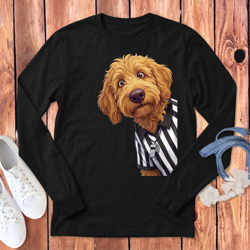 Golden doodle dog wearing a black and white striped referee shirt and whistle.