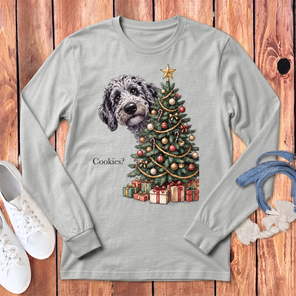 Doodle dog peeking out from behind a Christmas tree with gifts and text "Cookies?".
