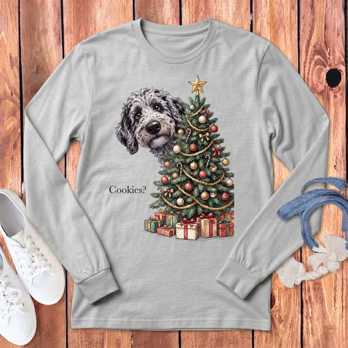 Doodle dog peeking out from behind a Christmas tree with gifts and text "Cookies?".