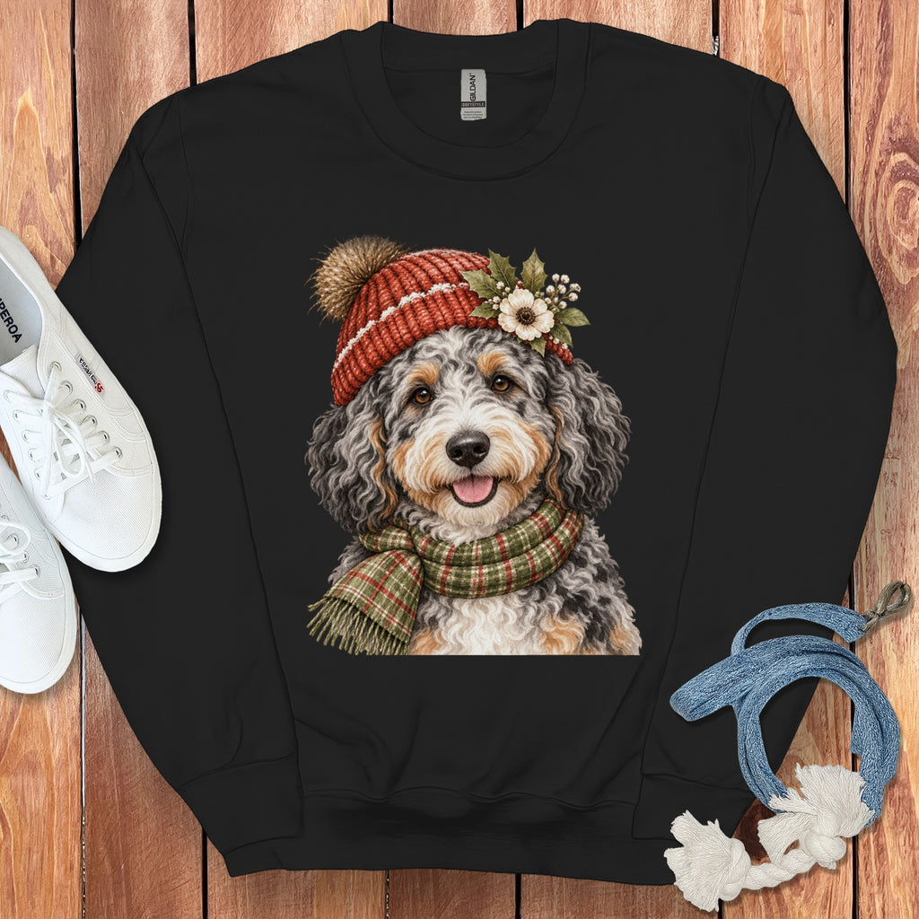 Black sweatshirt with a printed watercolor image of a dog wearing a Santa hat and scarf.