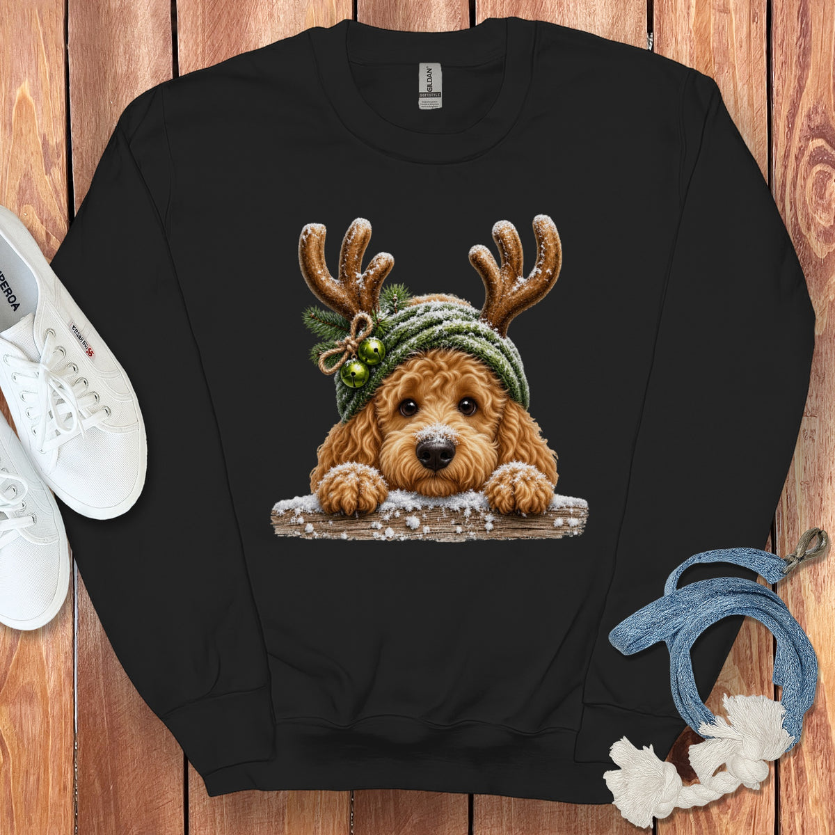 Black sweatshirt with a cute doodle dog wearing reindeer antlers and a winter hat.