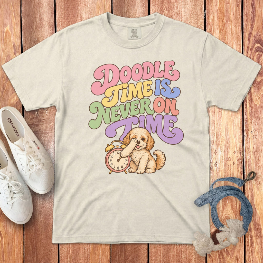 Off-white t-shirt featuring retro text reading Doodle Time is Never on Time above an illustrated puppy with an alarm clock.
