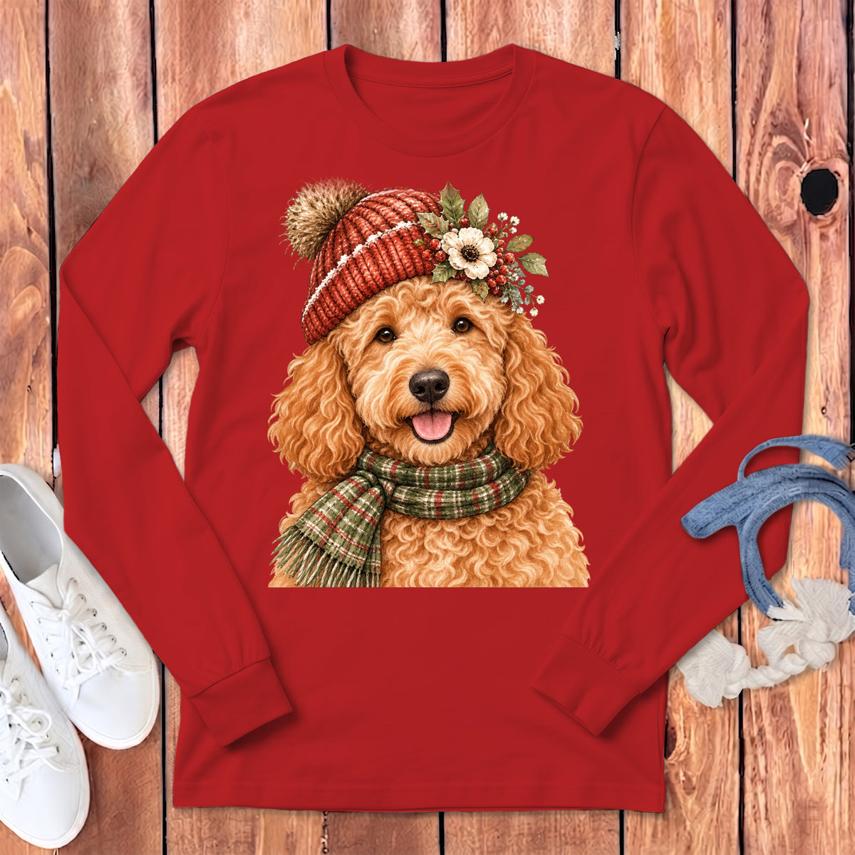 Red long-sleeve shirt with a cute goldendoodle wearing a festive hat and scarf.