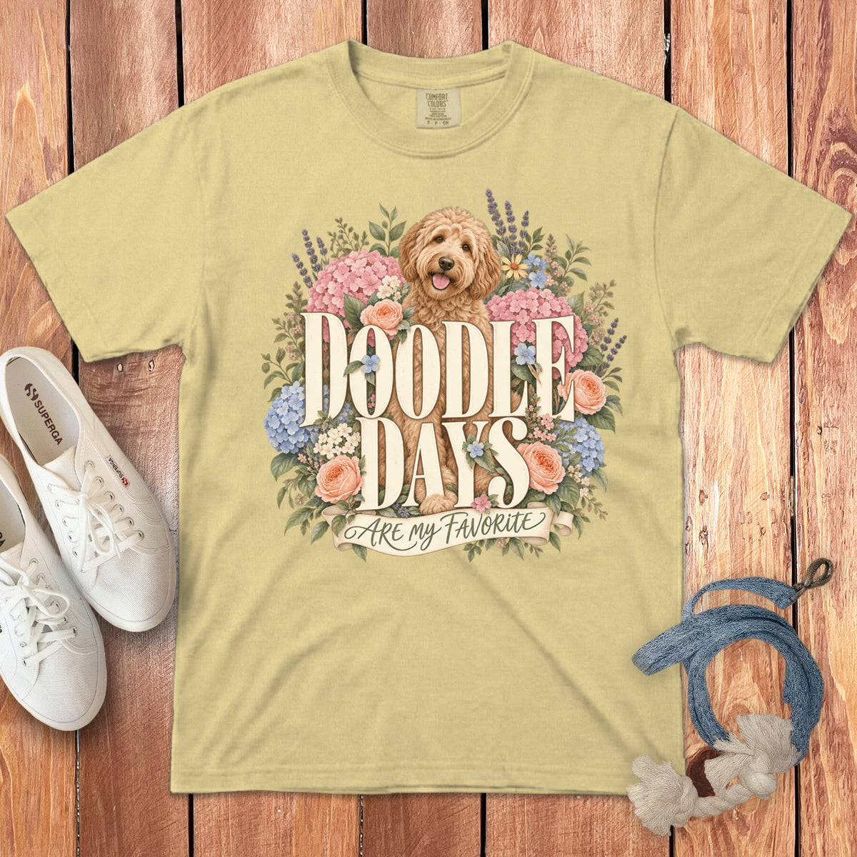 Light yellow t-shirt with a doodle dog surrounded by flowers and text "Doodle Days Are My Favorite".