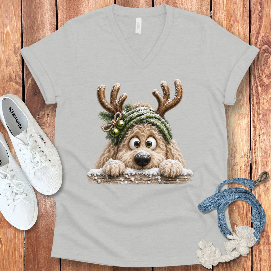 Light grey v-neck t-shirt featuring a cartoon dog with reindeer antlers in snow.