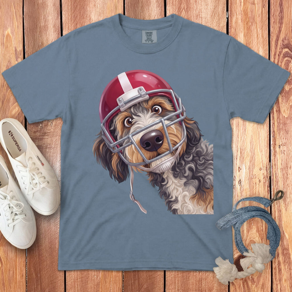Blue t-shirt with a digital illustration of a dog wearing a red football helmet.