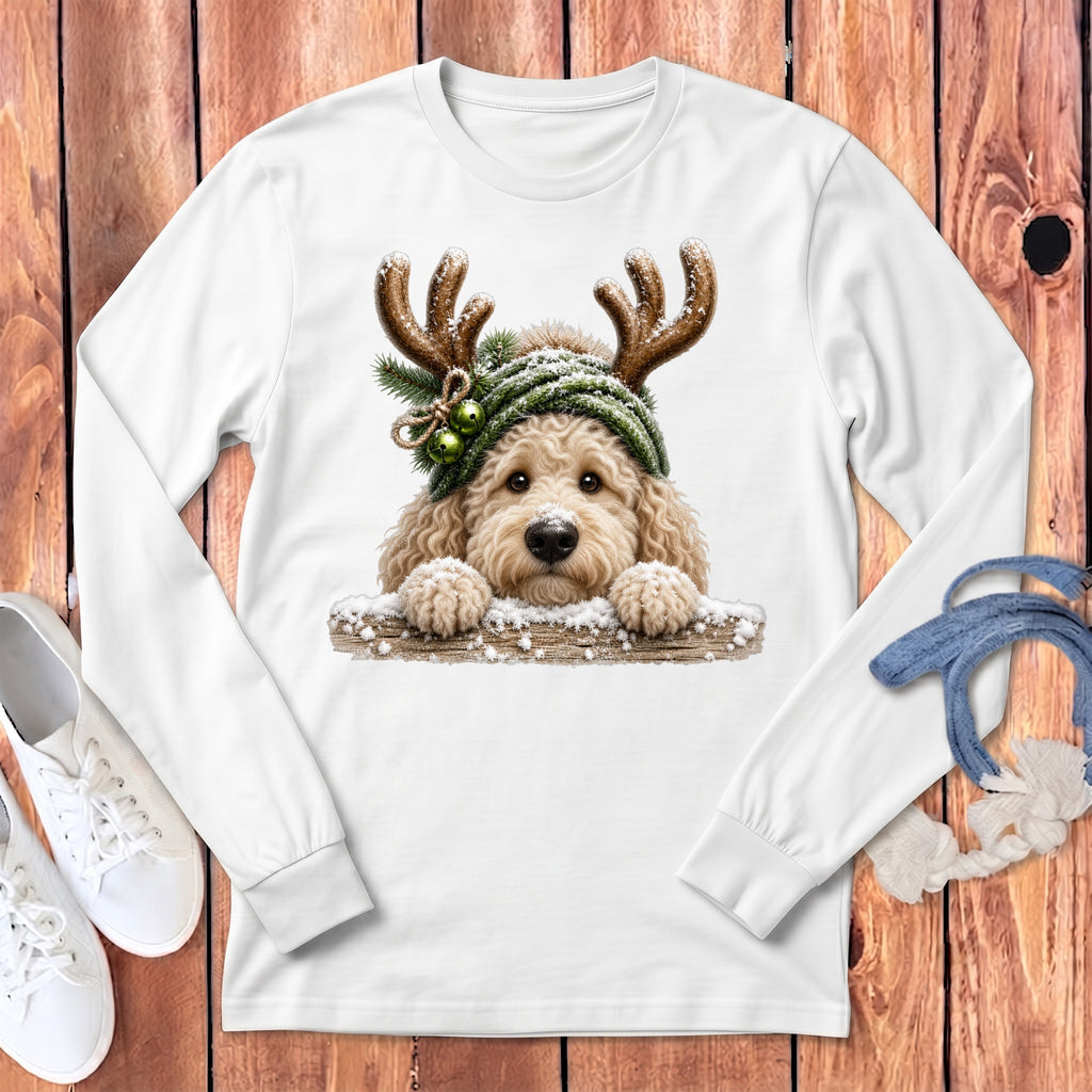 White long-sleeve shirt with a doodle dog wearing antlers and a green winter hat.