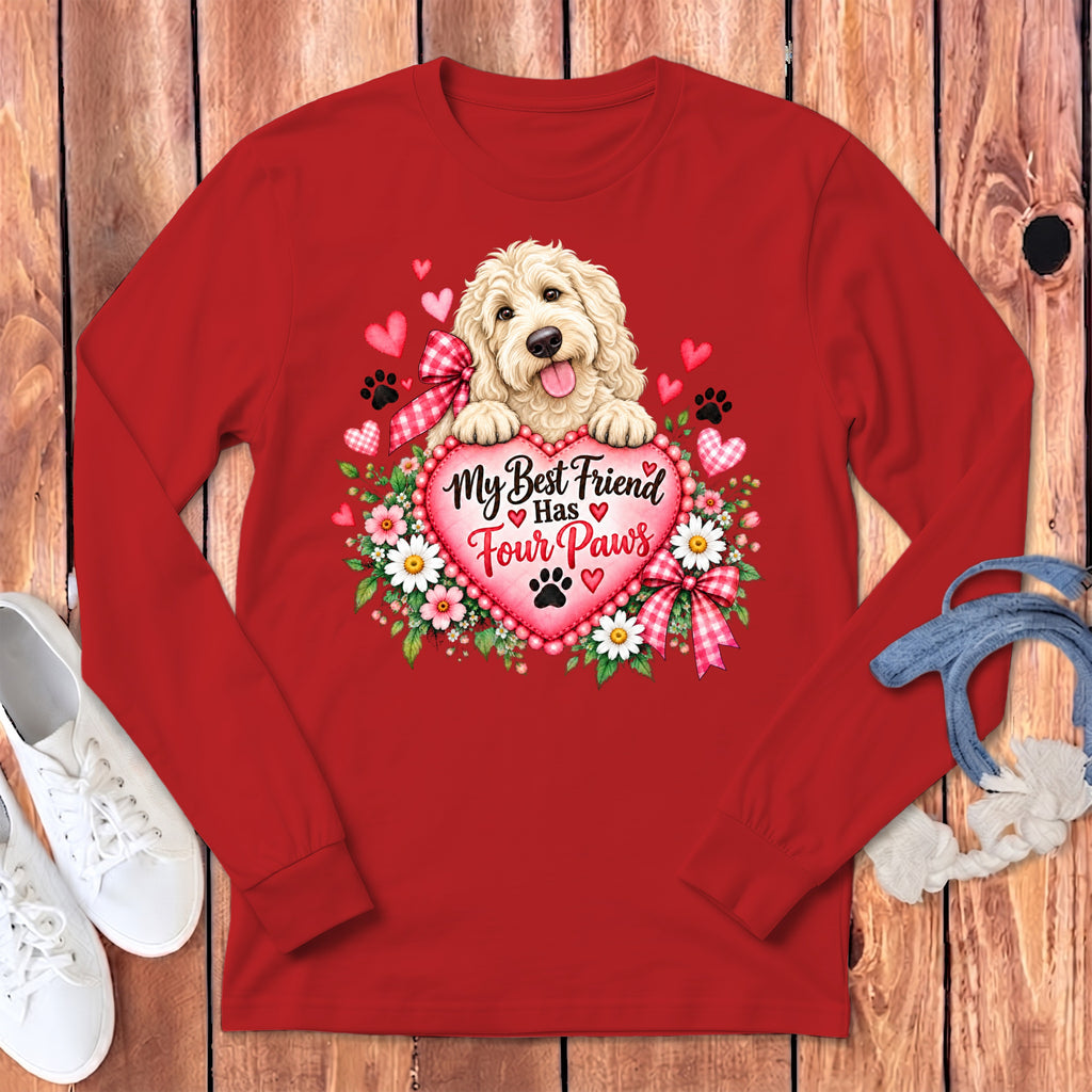 A red long-sleeve t-shirt with a graphic of a fluffy dog, a heart, and the text "My Best Friend Has Four Paws".