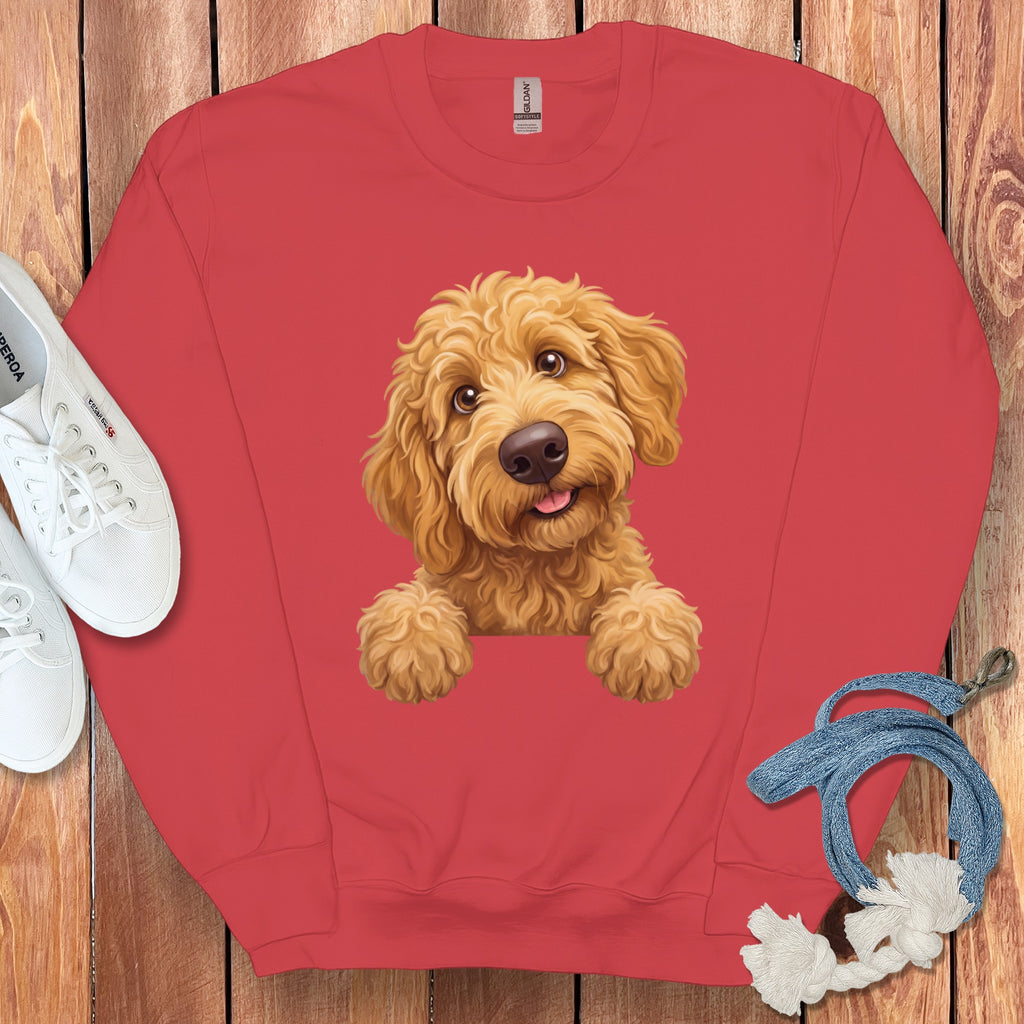Red crewneck sweatshirt with a digital illustration of a happy golden doodle dog.