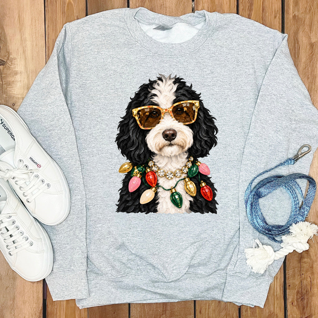 Gray sweatshirt with a black and white dog wearing sunglasses and a Christmas light necklace.