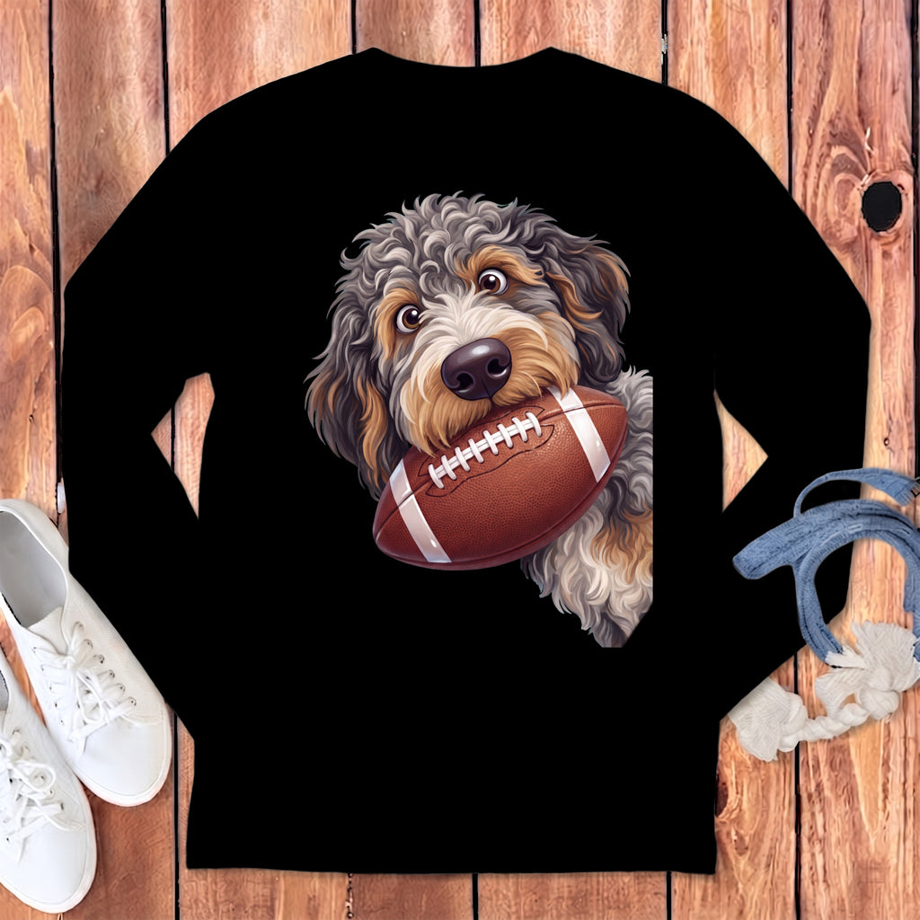 Black long-sleeved shirt featuring a graphic of a fluffy dog holding a football in its mouth.