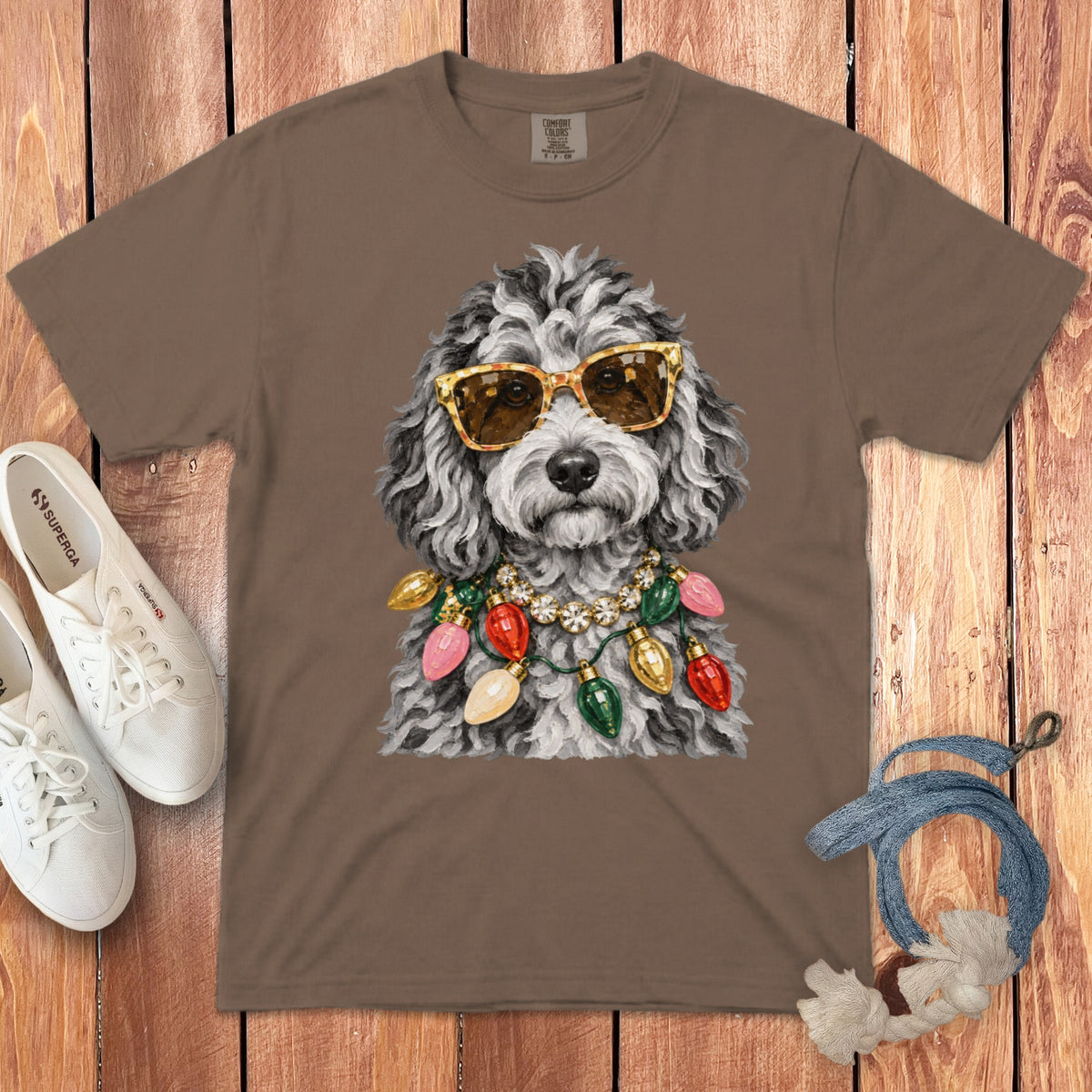 T-shirt with a dog wearing sunglasses and a Christmas light necklace.