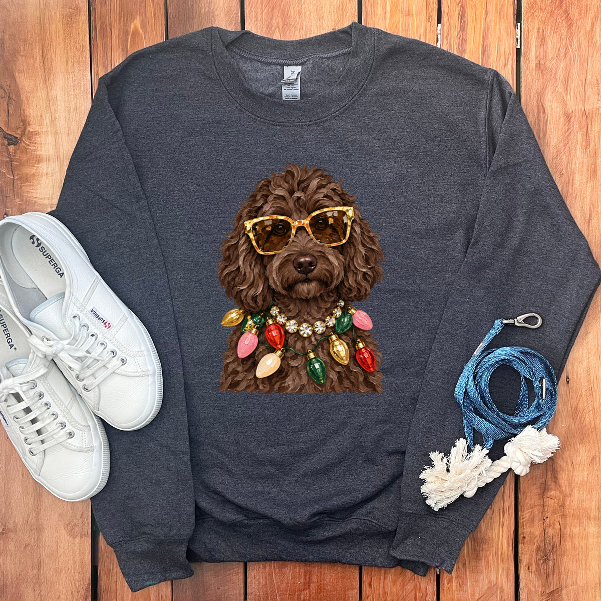 Dark grey sweatshirt with a brown dog wearing sunglasses and Christmas lights.