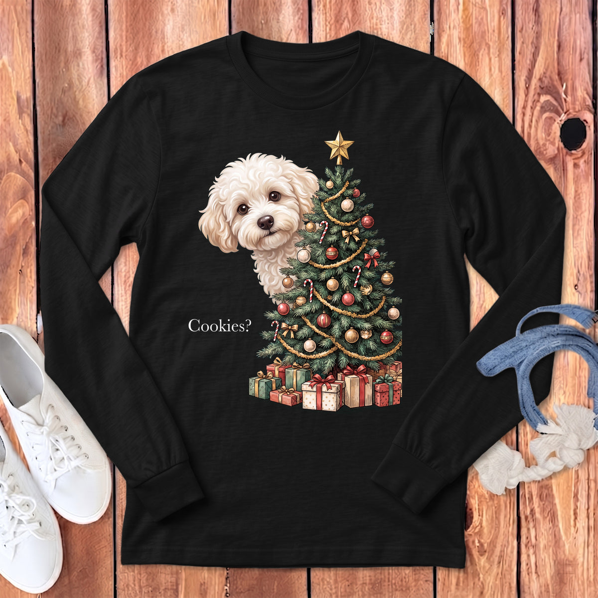 Fluffy white dog peeking behind a decorated Christmas tree and presents, asking "Cookies?".