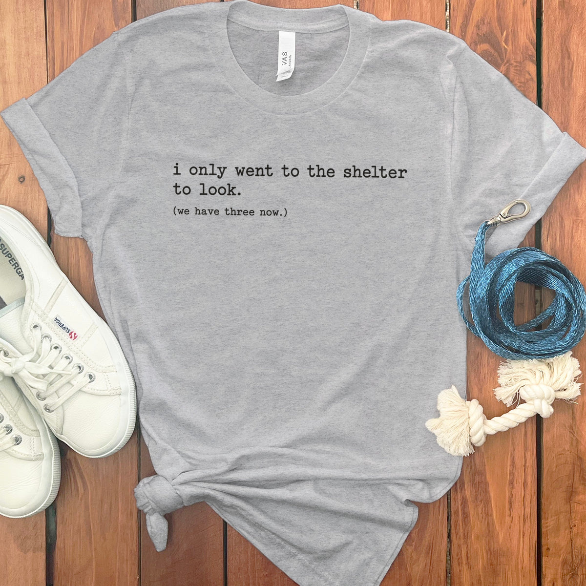 Grey t-shirt with text: "i only went to the shelter to look. (we have three now.)"