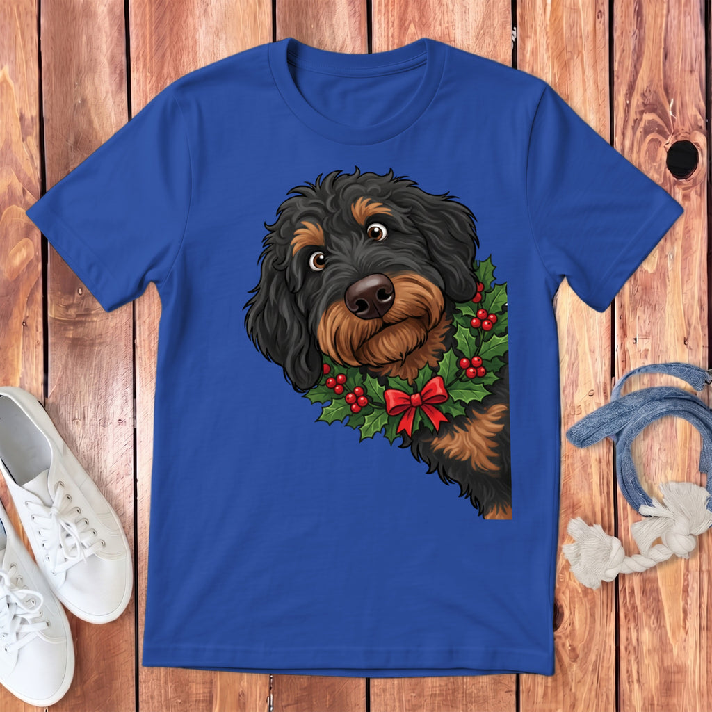 Blue t-shirt featuring a dog with a holly wreath and red bow.