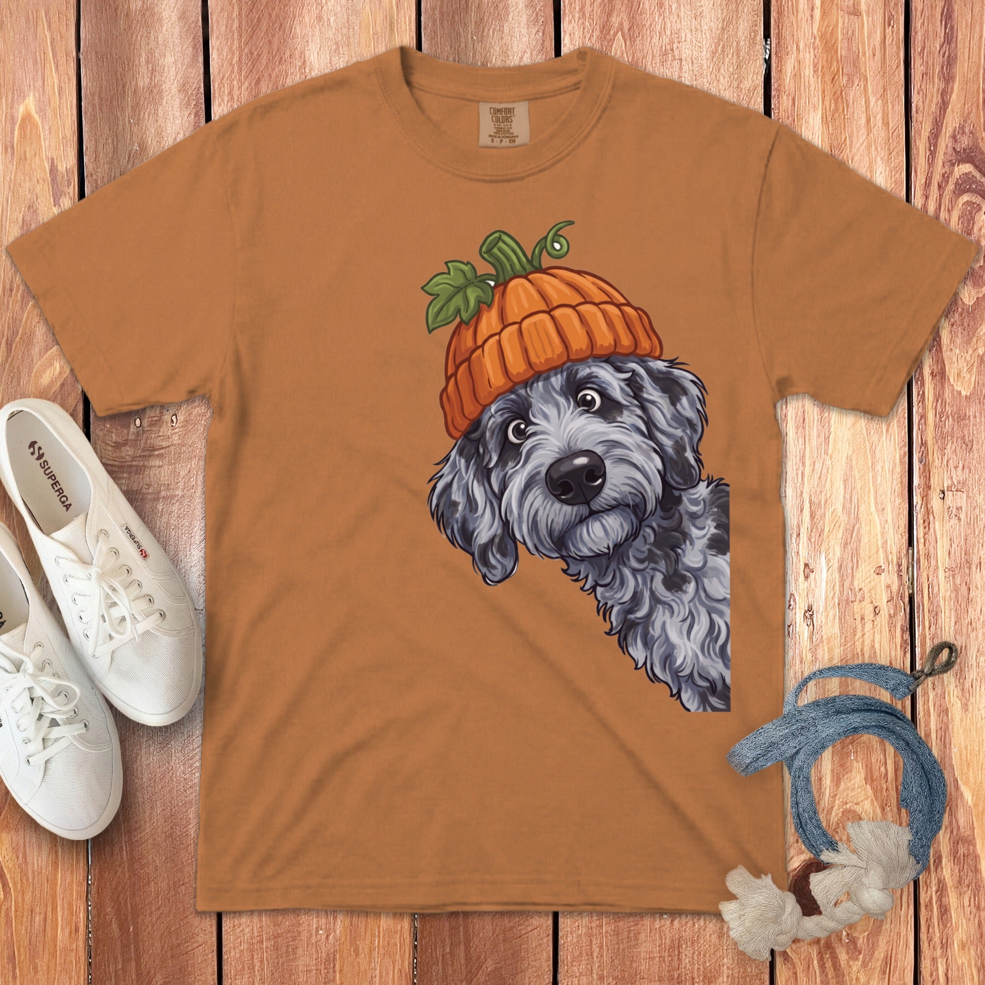 T-shirt with a cartoon dog wearing a pumpkin hat.
