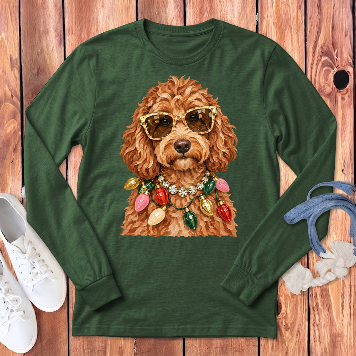 Long-sleeve green t-shirt with a doodle dog wearing sunglasses and Christmas lights.