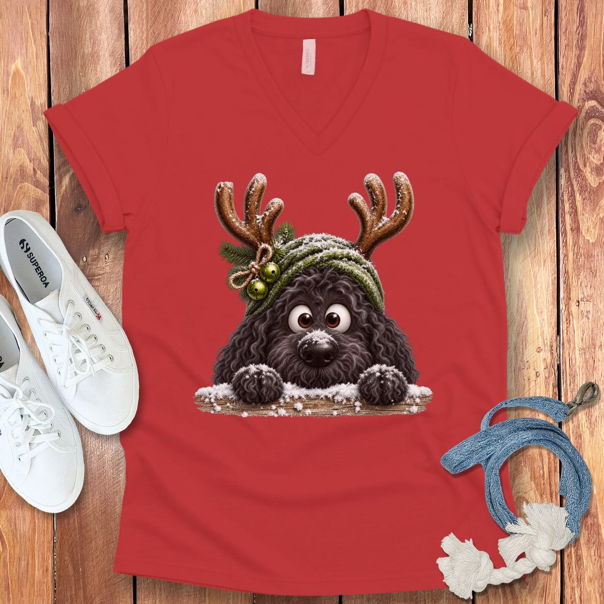 Red v-neck t-shirt with a cartoon dog wearing reindeer antlers and a hat.