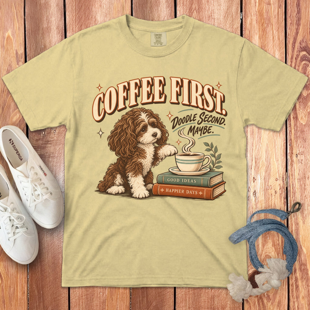 Light yellow t-shirt featuring a brown and white doodle dog with books, coffee, and retro text.
