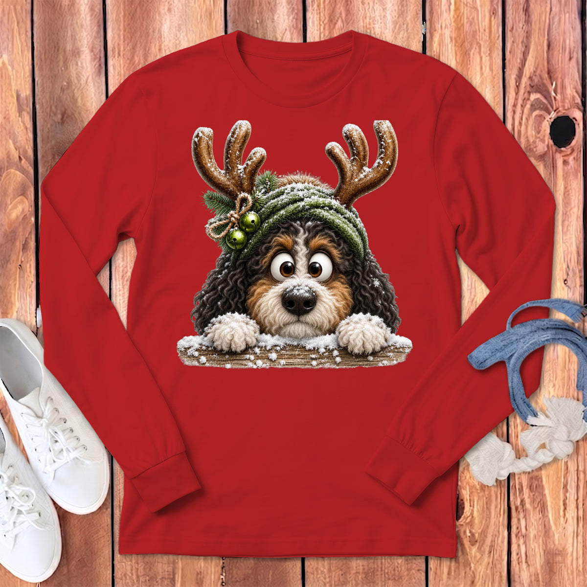 Red long-sleeved shirt with a cute Bernese Mountain Dog wearing reindeer antlers and a hat.
