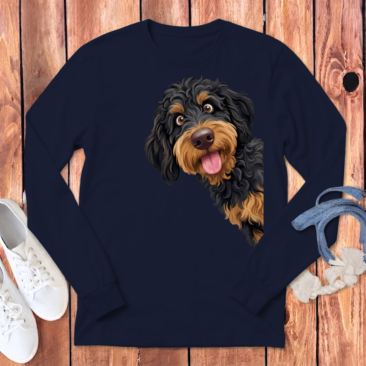 Long sleeve navy t-shirt with a black and tan doodle dog graphic peeking out.