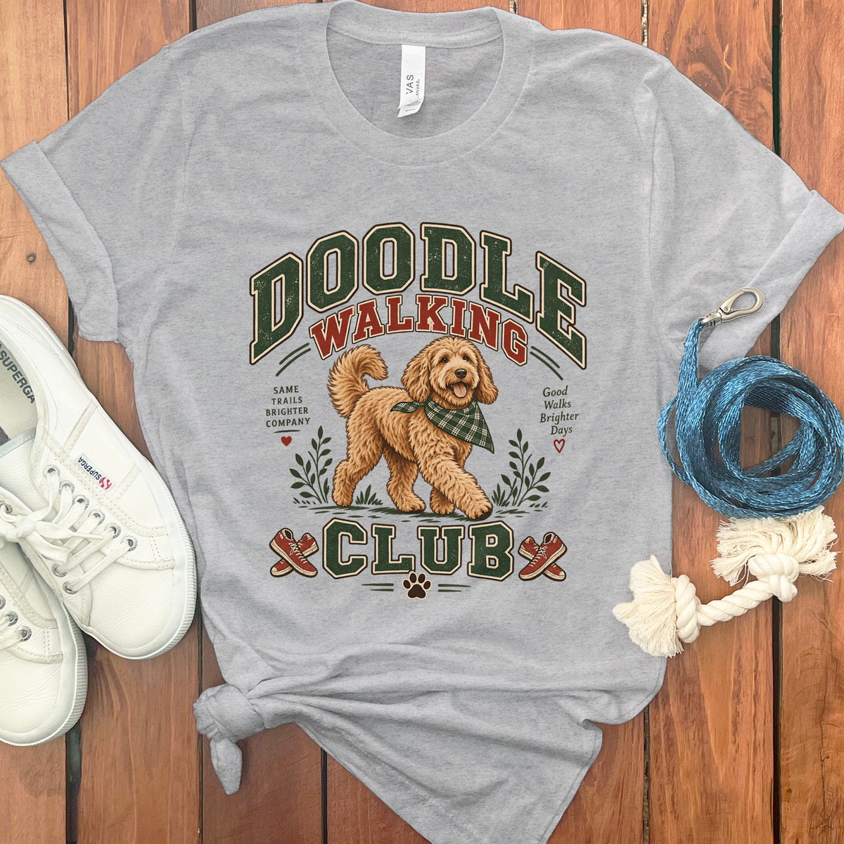 Grey t-shirt with Doodle Walking Club graphic featuring a dog and text.