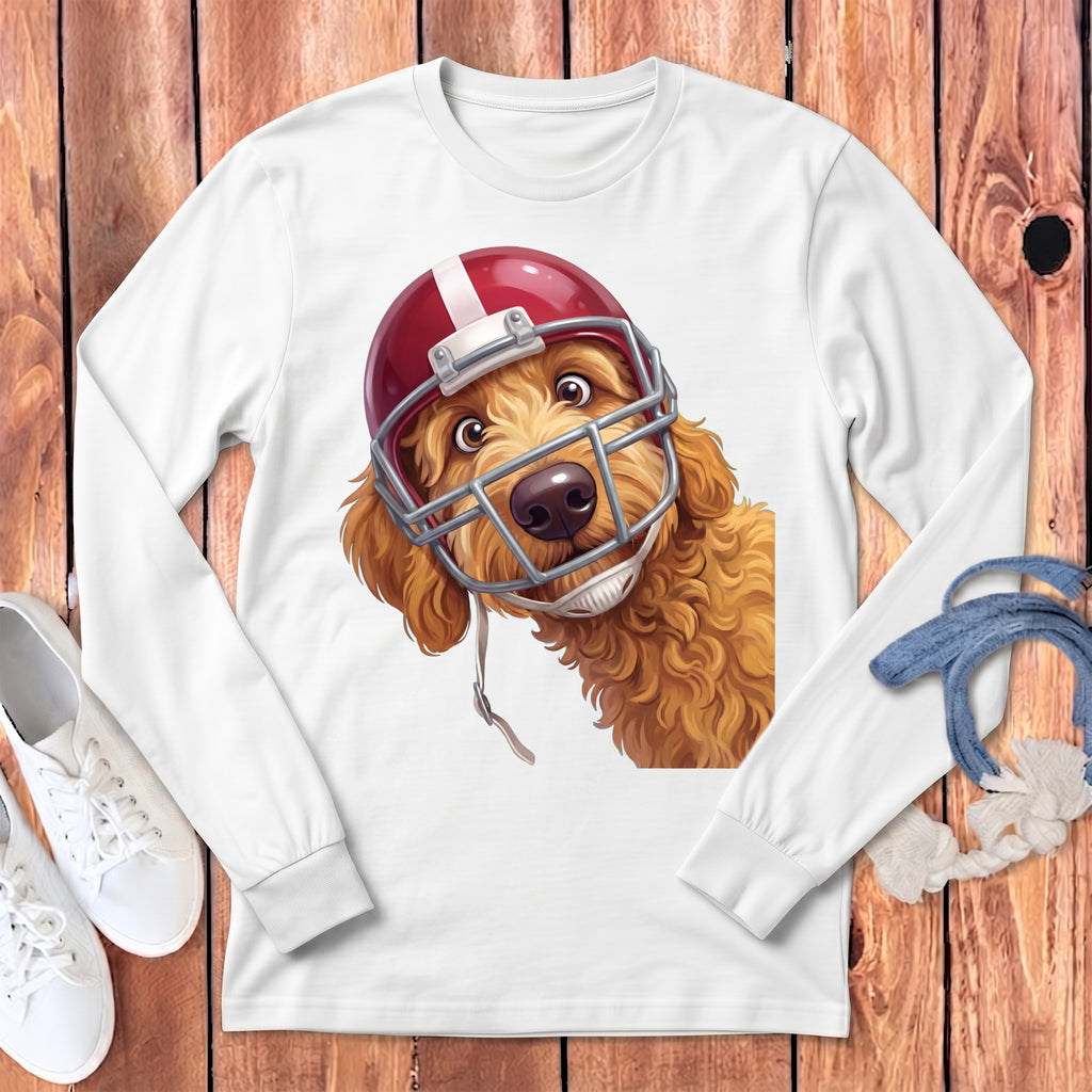 A white long-sleeved shirt features a graphic of a fluffy golden doodle wearing a football helmet.