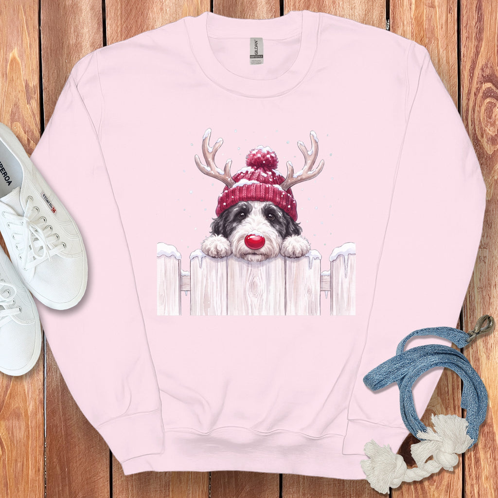 Pink sweatshirt with a watercolor dog wearing a Santa hat and reindeer antlers.