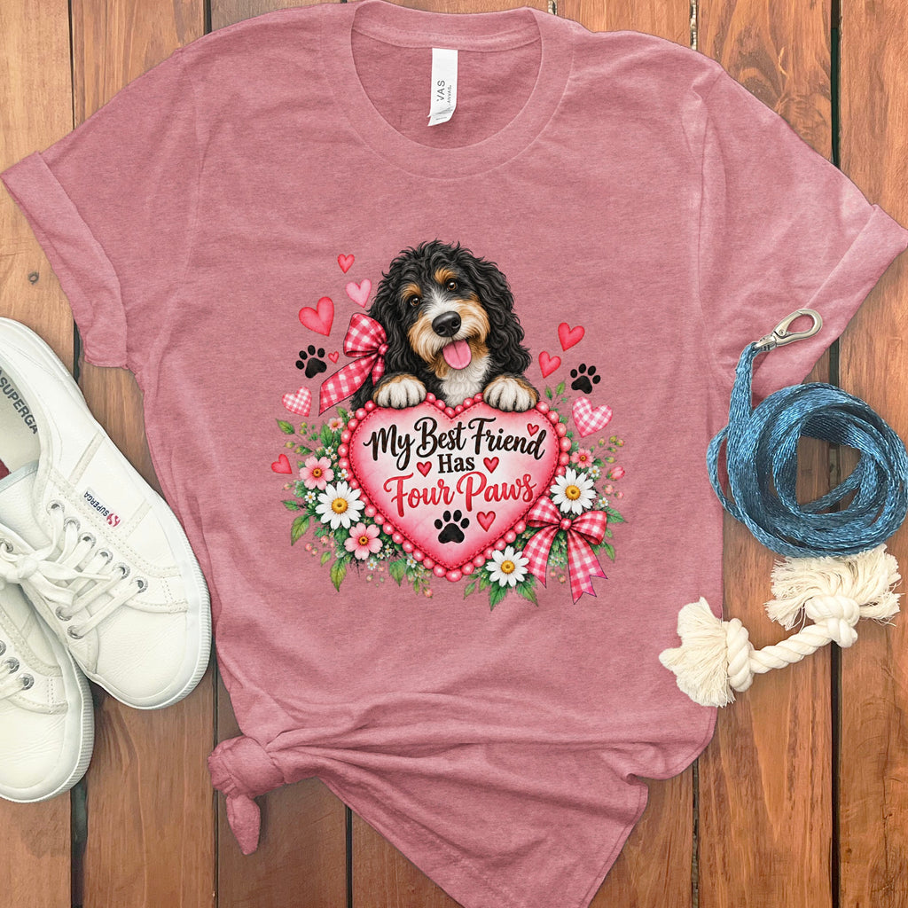 Mauve t-shirt featuring a bernedoodle puppy holding a heart graphic with the text My Best Friend Has Four Paws.
