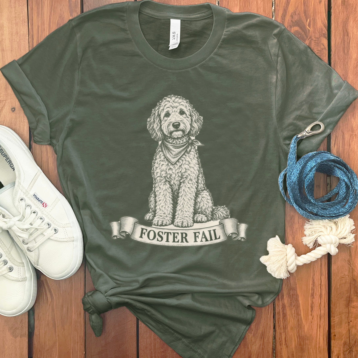 Green t-shirt with a doodle dog illustration and "Foster Fail" text.
