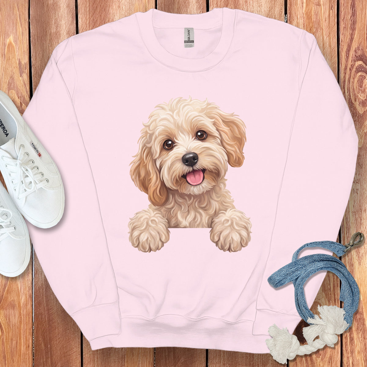Pink sweatshirt with a printed image of a cute, fluffy dog.