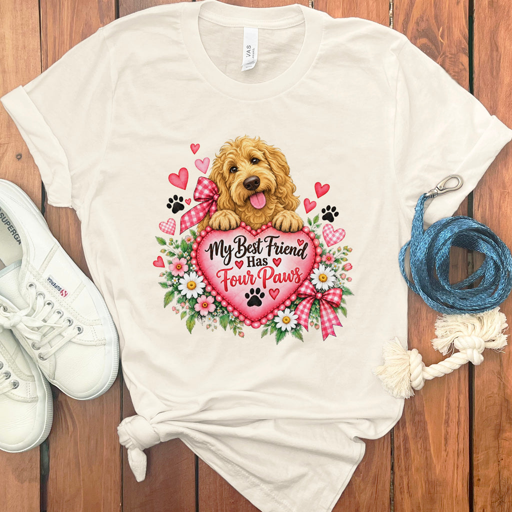 White crewneck t-shirt featuring a Golden Doodle graphic, surrounded by flowers, hearts, and the text My Best Friend Has Four Paws.