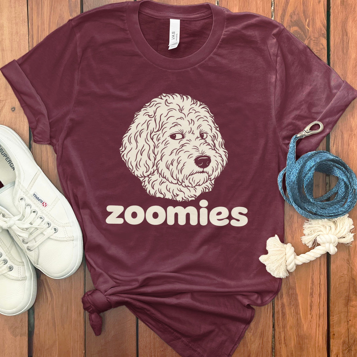 Maroon t-shirt with a sketched dog face and "zoomies" text.