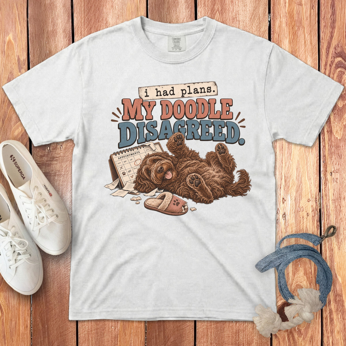 White t-shirt with a graphic of a brown doodle dog and the text MY DOODLE DISAGREED.