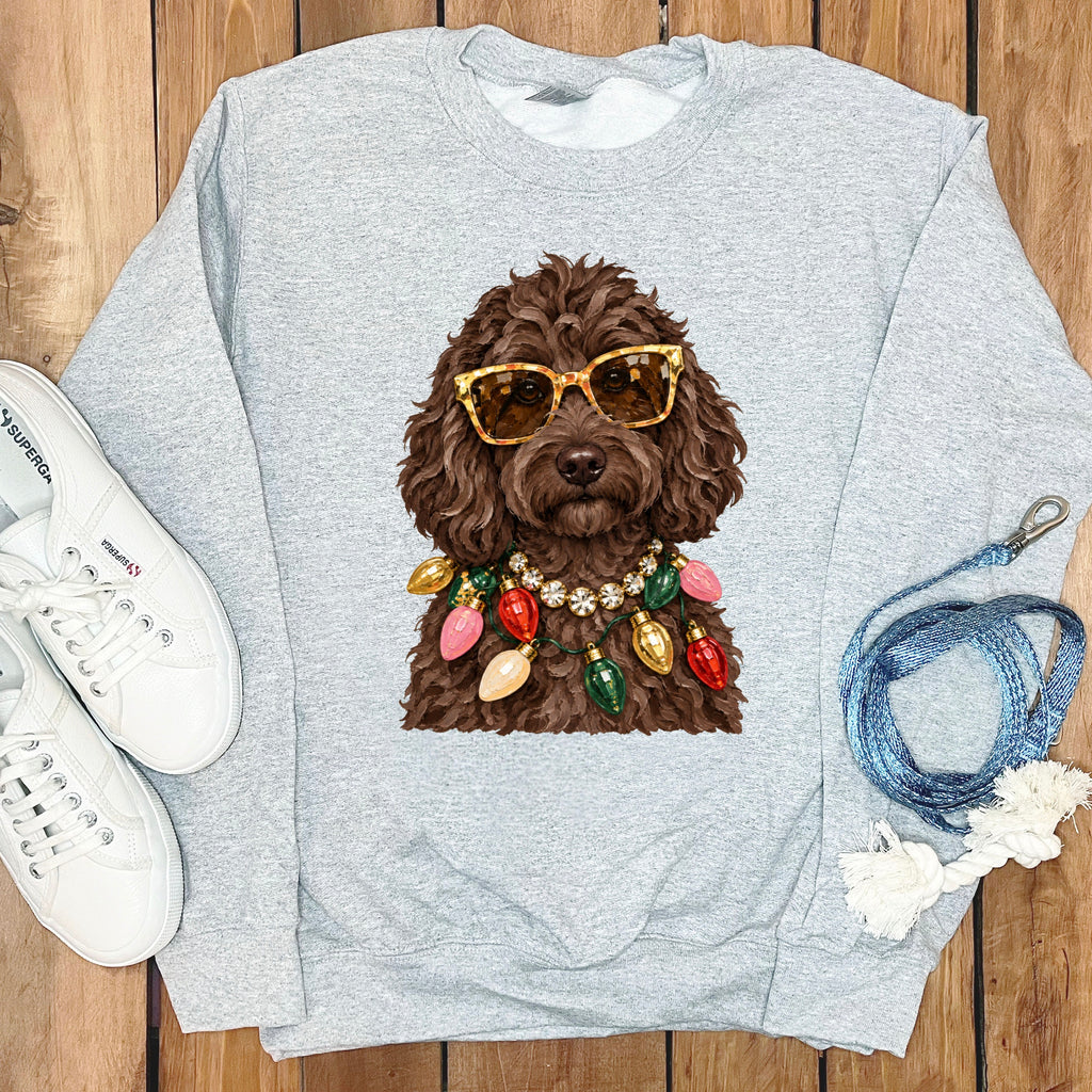 Light gray sweatshirt with a brown dog wearing sunglasses and Christmas lights.