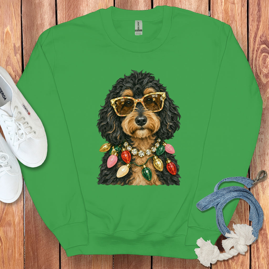 Green sweatshirt with a doodle dog wearing sunglasses and a Christmas light necklace.