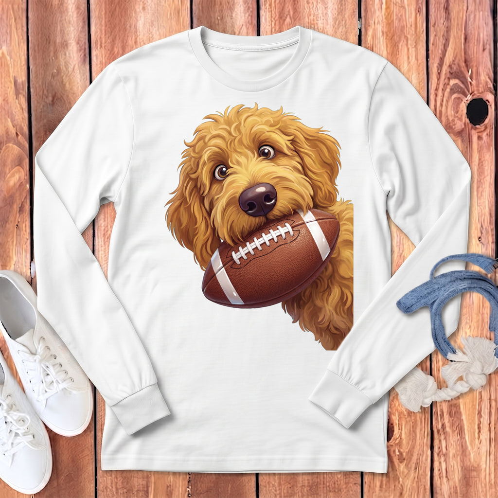A white long-sleeved shirt featuring a graphic of a golden doodle dog holding a football.