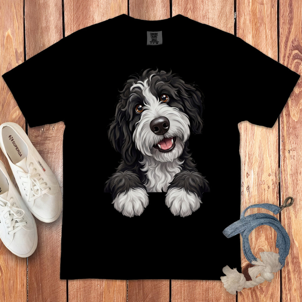 Black t-shirt with a cartoon Portuguese Water Dog design, featuring white sneakers.
