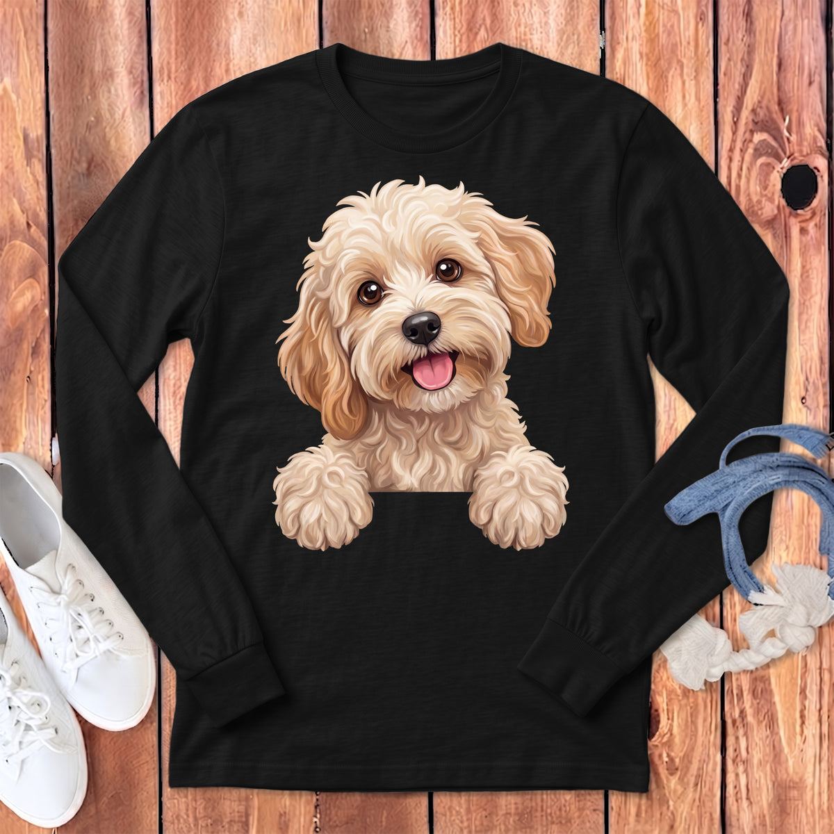 Black long-sleeved shirt with a cheerful, fluffy cream-colored dog graphic.