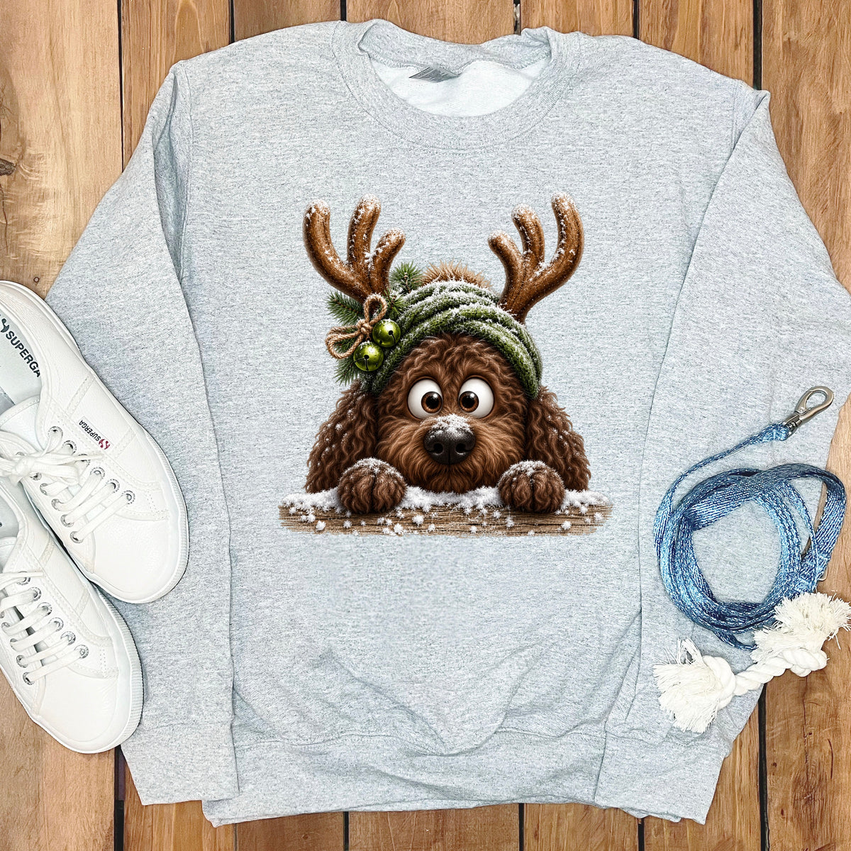 Light grey sweatshirt with a cartoon dog wearing antlers and a festive hat.