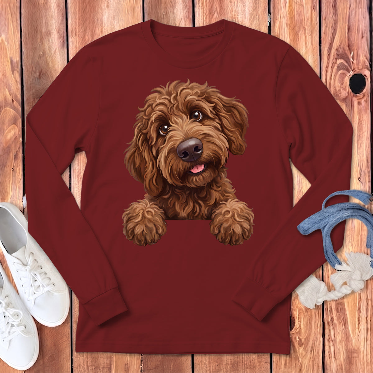 Maroon long-sleeve shirt featuring a smiling brown doodle dog illustration.