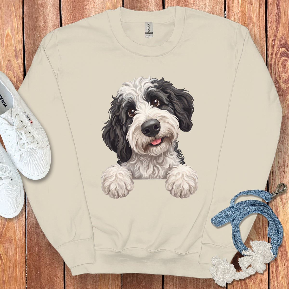 Cream sweatshirt with black and white dog illustration and Gildan tag.
